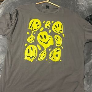 grey tee with yellow smiley faces.